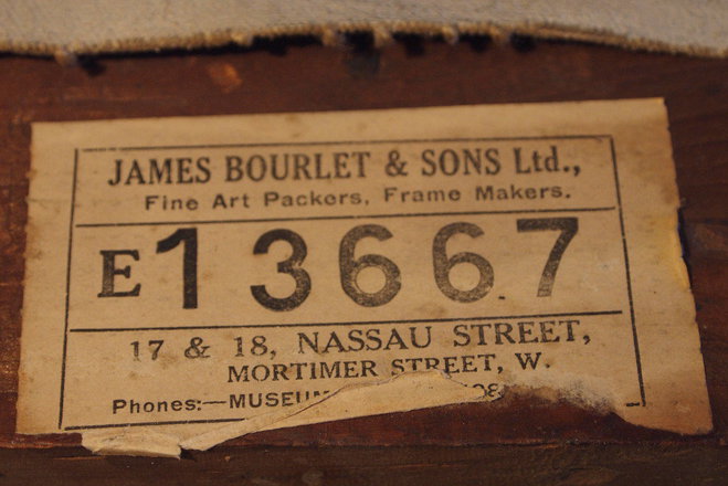The stretcher maker's label on the reverse of the Annan oil painting 'Hide & Seek'