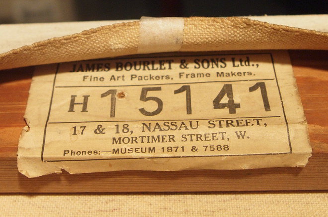 The stretcher maker's label on the reverse of the Annan oil painting 'Circus'